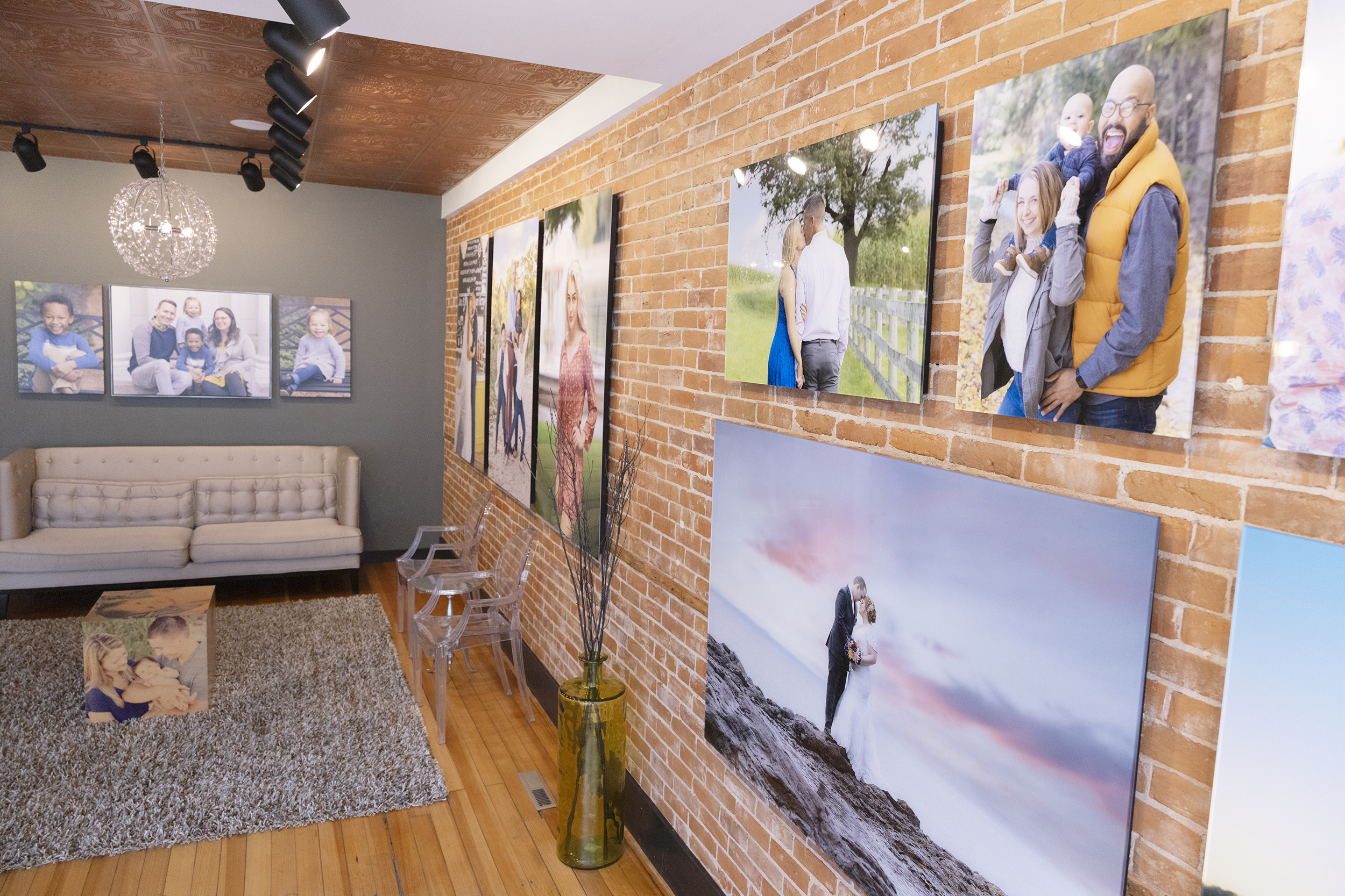 Mueller Photography reception area. Mueller Photography is your destination for capturing life's precious moments. With a focus on family portraits and wedding photography, we specialize in creating stunning wall art for your home and crafting custom-designed albums that tell your story.