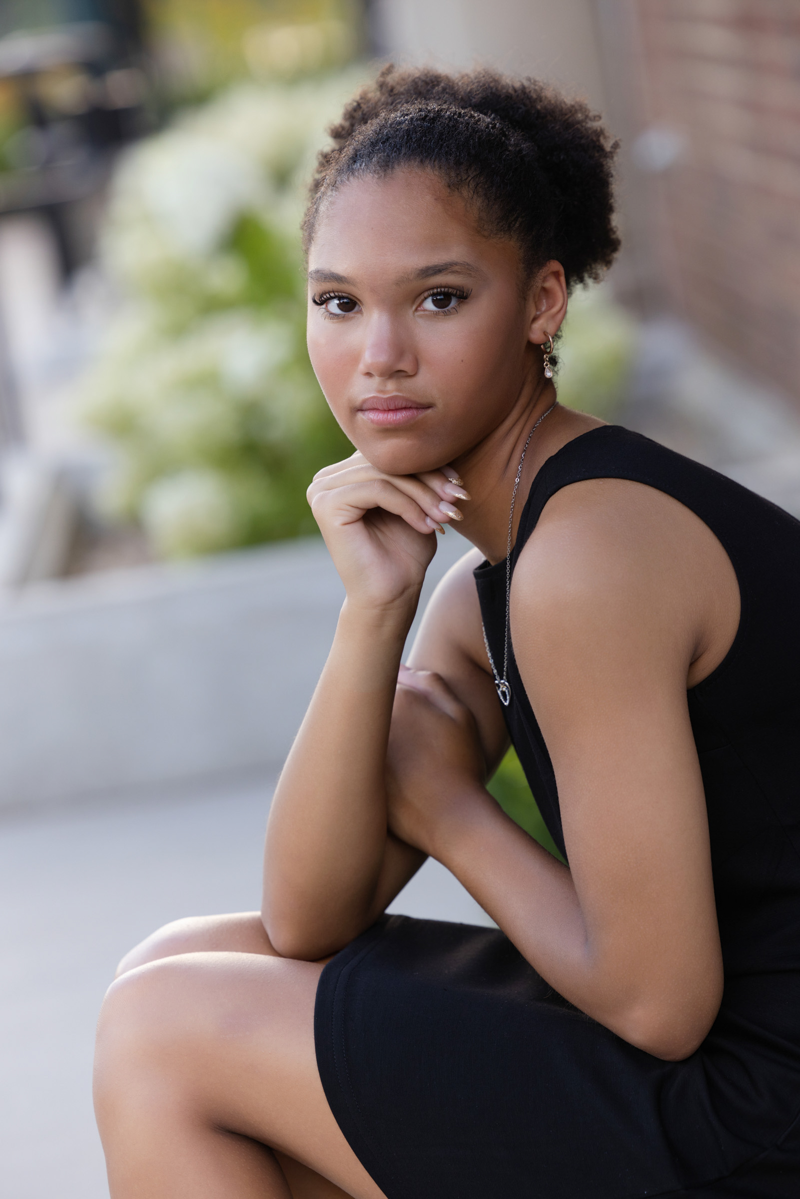 Close-up portrait of a high school senior posing during an outdoor session.