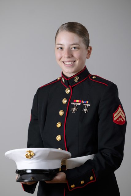 Professional portrait of a person in military dress uniform against a neutral studio background.
