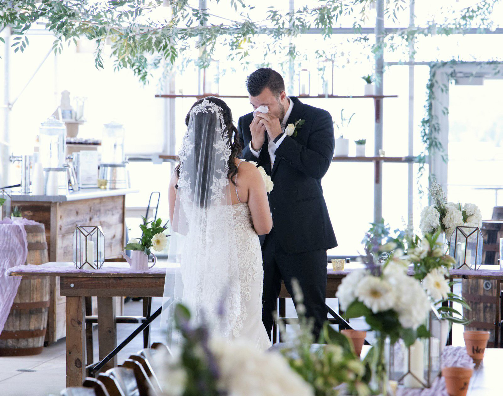 Bride and groom sharing an emotional first look during their wedding day photographed by Mueller Photography.